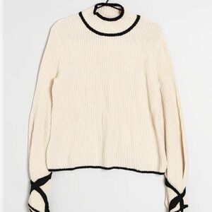 Elegant Cream Sweater with Black Accents